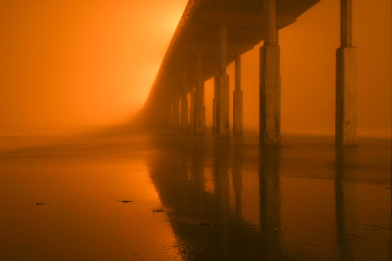 Foggy Notion1.jpg :: The socked in fog reflects the pier lights and a long shutter speed results in an orange glow and an artistic representation of the Pier. (A2:3) (LE3k)