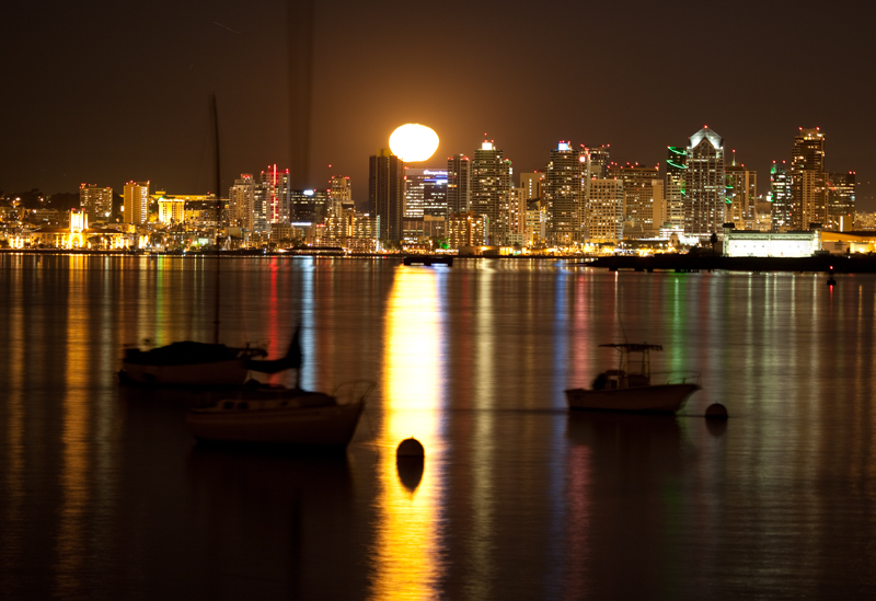 Morring by Moonlight.jpg :: A mooring ball in the foreground is illuminated by the rising moon. San Diego has a nice skyline and in this case it's accented by floating boats nearby. (A2:3) (LE4k)