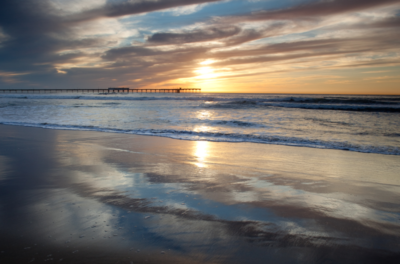 Pier Review.jpg :: More than a normal sunset, and standing in the water, we see the reflection of the sunset in the sand.  Note the quickly drying sand at the bottom of the image. (A2:3) (LE5k)
