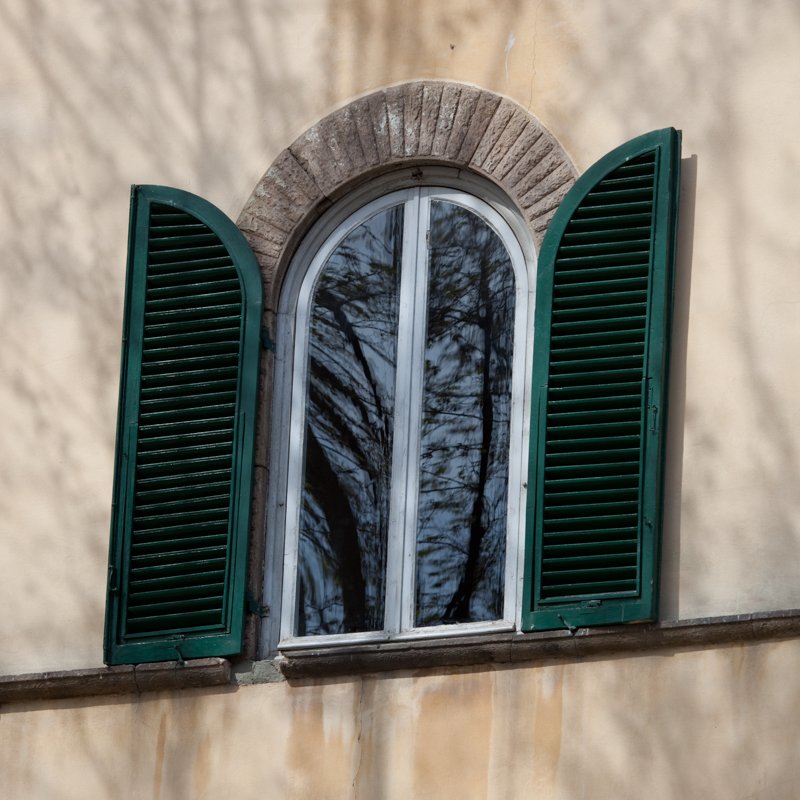 Tuscan Window.jpg :: A typical Italian window with the overlay of the shadows from nearby trees sets this Italian courtyard scene. (A1:1) (LE3k)