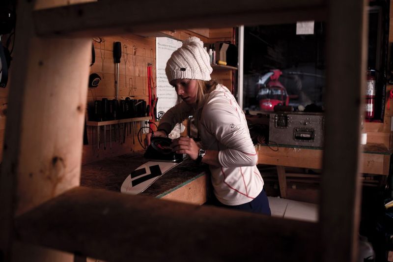 ralphie_U5C0639 3.jpg :: Angel Collinson tuning her skis at Snowwater Heliskiing, BC