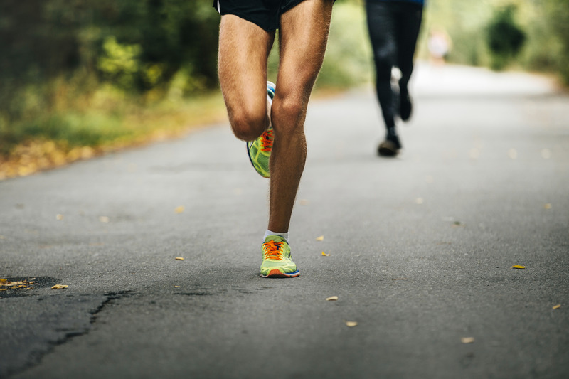 photodune-18550160-leader-of-marathon-young-athlete-runner.jpg :: leader of marathon young athlete runner running on road in autumn Park