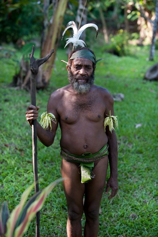 CHEIF SARAKUMAL.jpg :: VILLAGE OF MELDEMES.  ISLAND OF MALEKULA, VANUATU.    In the South Bay region of Malekula the ni-Vanuatu recognize the impermanence of cultural history and traditions. Chief Sarakamal is one of many ni-Vanuatu people in this Country that work to maintain ancient ways and teach them with visitors and the young ni-Vanuatu. It is, after all, the young native people who hold the keys to not only moving Vanuatu forward in a modern world but also in recognizing the important cultural traditions and values that make Vanuatu extremely unique in this world. 
