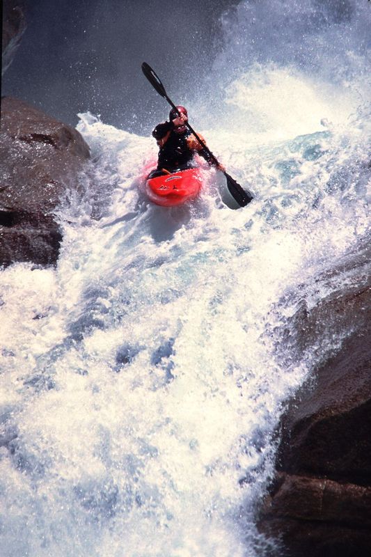 CHERRY BOMB.jpg :: CHERRY CREEK GORGE, EMIGRANT WILDERNESS, CALIFORNIA.    
A kayaker drops over Class V+ Cherry Bomb Falls. One of many similar challenges in this canyon. 

 
