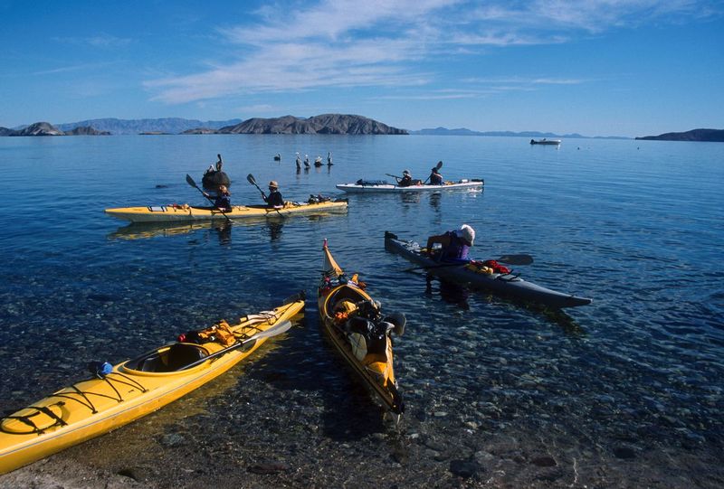 GETTING UNDERWAY.jpg :: BAHIA DE LOS ANGELES - SEA OF CORTEZ, BAJA MEXICO.    
A sea kayaking group prepares to begin their weeklong journey to peaceful uninhabited islands 




