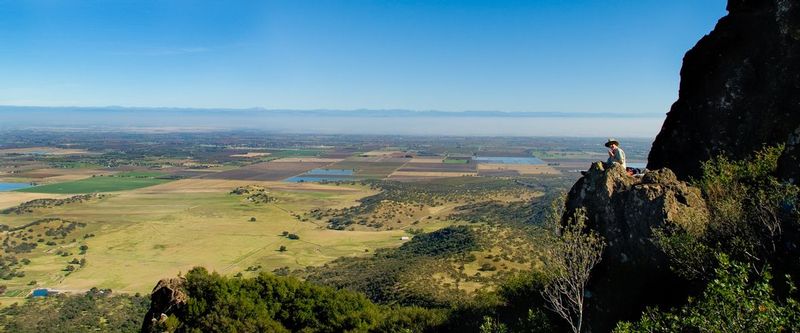 LUNCH WITH A VIEW.jpg :: NORTH BUTTE - SUTTER BUTTES, CALIFORNIA.    
A lone diner takes in the ambience atop North Butte in the heart of the California Great Central Valley. 
At 1,827 feet above sea level the views are well worth the steep climb to the top of this ancient volcano complex rising directly from the flat valley floor. 


