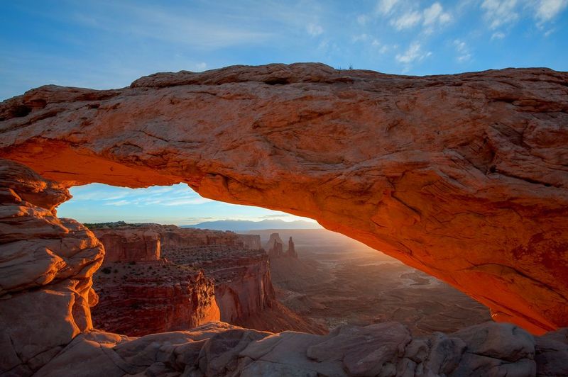 MESA ARCH.jpg :: CANYONLANDS NATIONAL PARK, UTAH.     
Mesa Arch is one of the most dramatic sunrise locations in the world. The arch extends out over the east facing red sedimentary cliffs overlooking the Colorado River. The first rays of sunrise reflect upward off the cliff directly onto the underside of the arch turning it electric orange for a few magical moments 

Canyonlands National Park, Utah 
Mesa Arch is one of the most dramatic sunrise locations in the world. The arch extends out over the east facing red sedimentary cliffs overlooking the Colorado River. The first rays of sunrise reflect upward off the cliff directly onto the underside of the arch turning it electric orange for a few magical moments 