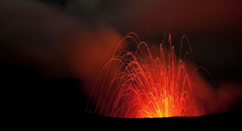 MOUNT YASSUR.jpg :: MOUNT YASUR - TANNA ISLAND, VANUATU.     
The strombolian volcano of Mount Yasur has been actively erupting for a thousand years or more. Aerial lava bombs and deep percussions impact the caldera apron on a regular interval of about 5 to 10 minutes. This place is the primal power of nature in a massive scale. The feel of the shockwaves and the intense images of a sky full of molten lava will remain with one forever.