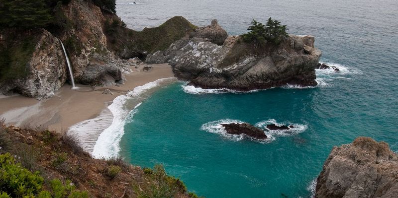 McWAY FALLS.jpg :: JULIA PFIEFFER BURNS STATE PARK - BIG SUR, CALIFORNIA.   
This dramatic California waterfall is easily one of the states most beautiful and iconic. 
Perennial water from the creek tumbles 80 feet onto the beach and the picturesque emerald green of McWay Cove. 
