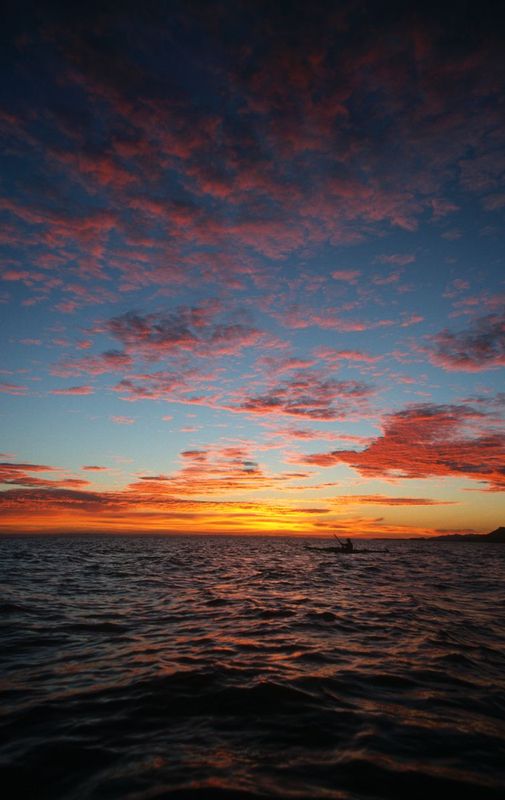 SERENITY.jpg :: BAHIA DE LOS ANGELES - SEA OF CORTEZ, BAJA.    
A lone sea kayaker greets New Years Day on the Sea of Cortez 