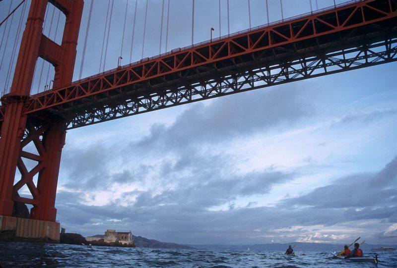 UNDER THE GOLDEN GATE.jpg :: SAN FRANCISCO BAY, CALIFORNIA.    
A group of sea kayakers brave strong winds and swift currents to venture underneath the Golden Gate Bridge 

 

