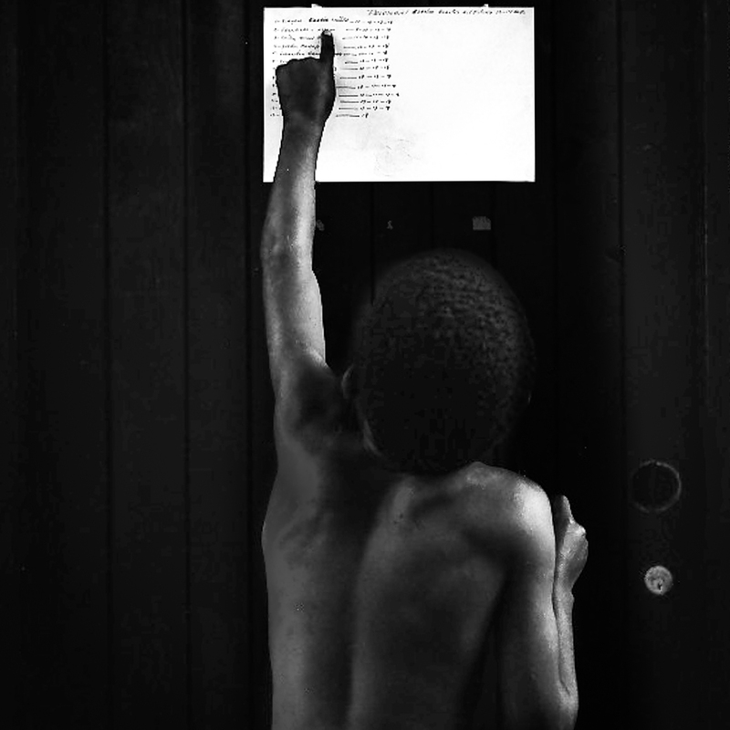 Cuba Boxing Gym Boy Pointing at Chart(1).jpg