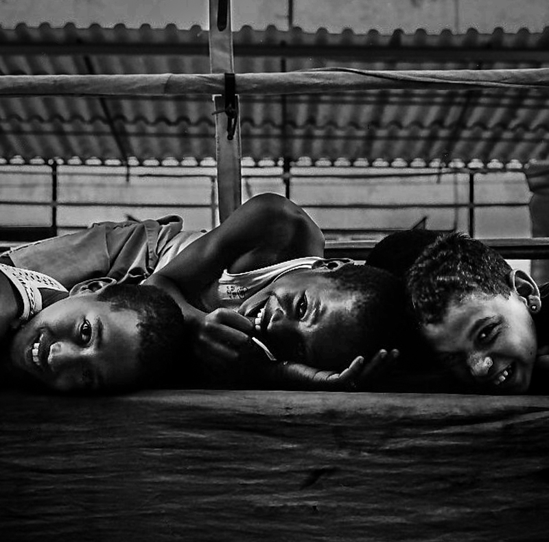 Cuba boxing boys lying on mat.jpg