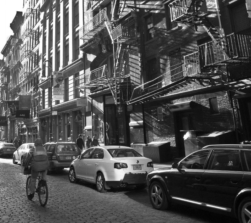 Bicyclist on cobblestone street.jpg
