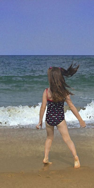 Beach Pirouette.jpg :: My granddaughter celebrating her first day at the beach, frozen in a dance on the waters edge, her excitement translates to an animated \