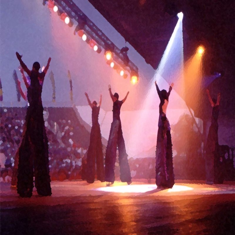 Giants.jpg :: Some very tall people dancing on stage, their balance was amazing to the audience and from backstage.