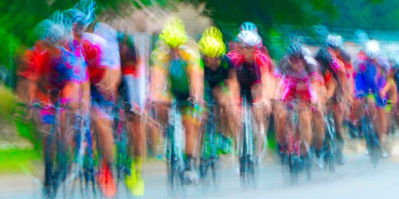 LineUp.jpg :: Each year at designated times, planned years or days in advance, cyclists will turn the streets of a city or the back roads of a quiet countryside into a blur of colors as they compete for a space on the winners podium, and the dream of one day being respected by their peers.