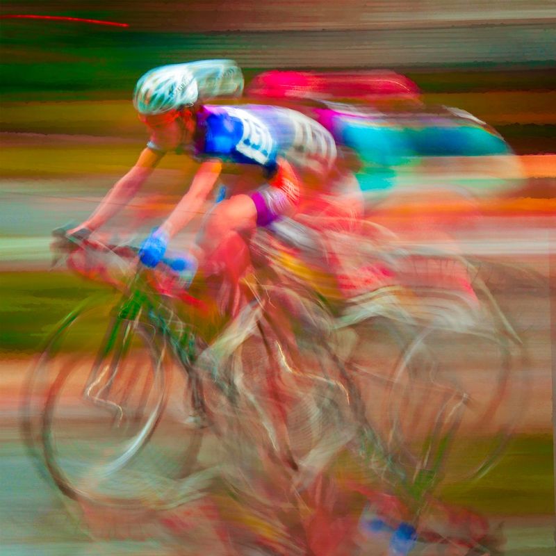 PassingGear.jpg :: Each year at designated times, planned years or days in advance, cyclists will turn the streets of a city or the back roads of a quiet countryside into a blur of colors as they compete for a space on the winners podium, and the dream of one day being respected by their peers.