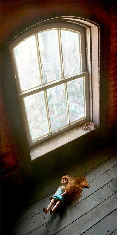 RedHead.jpg :: I'm not sure why this doll lay in front of the window in the upstairs ballroom of an old house I chose to explore - or who might have left it there - but it was a little creepy.  Visit Prospect Place - Dresden Ohio 