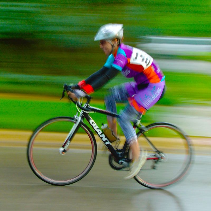 SingleRider.jpg :: Each year at designated times, planned years or days in advance, cyclists will turn the streets of a city or the back roads of a quiet countryside into a blur of colors as they compete for a space on the winners podium, and the dream of one day being respected by their peers.