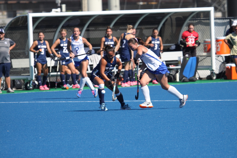 IMG_0373(1).jpg :: Saint Louis University (SLU) Women's Field Hockey vs University of California Davis 2025 at the SLU Field Hockey Complex. UC Davis won 2 to 1. The UC Davis players are wearing pink shoes and there are Pink Ribbons painted on the players sticks. Today is Billikens Pink Game for Breast Cancer Awareness and Alumnae Day. This is the second season at the new SLU Field Hockey Complex, and it marks, the 50th anniversary of the St. Louis University Field Hockey program which began in 1975. NCAA Division I 