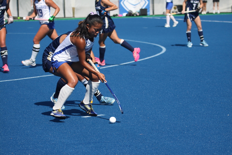 IMG_0397(1).jpg :: Saint Louis University (SLU) Women's Field Hockey vs University of California Davis 2025 at the SLU Field Hockey Complex. UC Davis won 2 to 1. The UC Davis players are wearing pink shoes and there are Pink Ribbons painted on the players sticks. Today is Billikens Pink Game for Breast Cancer Awareness and Alumnae Day. This is the second season at the new SLU Field Hockey Complex, and it marks, the 50th anniversary of the St. Louis University Field Hockey program which began in 1975. NCAA Division I 