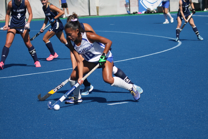 IMG_0399.jpg :: Saint Louis University (SLU) Women's Field Hockey vs University of California Davis 2025 at the SLU Field Hockey Complex. UC Davis won 2 to 1. The UC Davis players are wearing pink shoes and there are Pink Ribbons painted on the players sticks. Today is Billikens Pink Game for Breast Cancer Awareness and Alumnae Day. This is the second season at the new SLU Field Hockey Complex, and it marks, the 50th anniversary of the St. Louis University Field Hockey program which began in 1975. NCAA Division I 