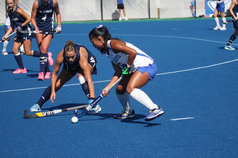 IMG_0402.jpg :: Saint Louis University (SLU) Women's Field Hockey vs University of California Davis 2025 at the SLU Field Hockey Complex. UC Davis won 2 to 1. The UC Davis players are wearing pink shoes and there are Pink Ribbons painted on the players sticks. Today is Billikens Pink Game for Breast Cancer Awareness and Alumnae Day. This is the second season at the new SLU Field Hockey Complex, and it marks, the 50th anniversary of the St. Louis University Field Hockey program which began in 1975. NCAA Division I 