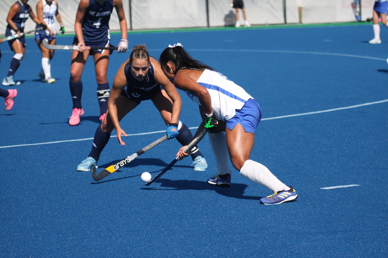 IMG_0403(1).jpg :: Saint Louis University (SLU) Women's Field Hockey vs University of California Davis 2025 at the SLU Field Hockey Complex. UC Davis won 2 to 1. The UC Davis players are wearing pink shoes and there are Pink Ribbons painted on the players sticks. Today is Billikens Pink Game for Breast Cancer Awareness and Alumnae Day. This is the second season at the new SLU Field Hockey Complex, and it marks, the 50th anniversary of the St. Louis University Field Hockey program which began in 1975. NCAA Division I 