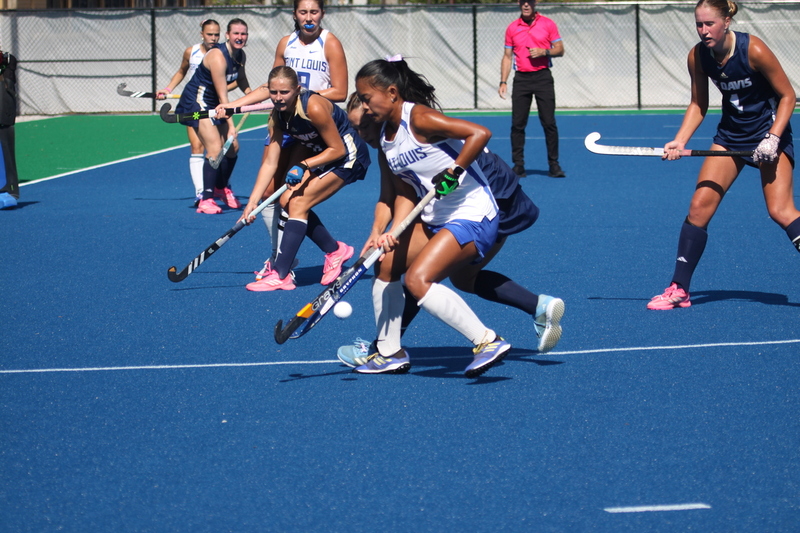 IMG_0406.jpg :: Saint Louis University (SLU) Women's Field Hockey vs University of California Davis 2025 at the SLU Field Hockey Complex. UC Davis won 2 to 1. The UC Davis players are wearing pink shoes and there are Pink Ribbons painted on the players sticks. Today is Billikens Pink Game for Breast Cancer Awareness and Alumnae Day. This is the second season at the new SLU Field Hockey Complex, and it marks, the 50th anniversary of the St. Louis University Field Hockey program which began in 1975. NCAA Division I 