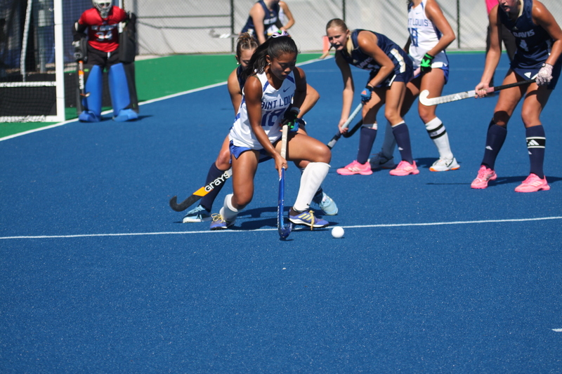 IMG_0408(1).jpg :: Saint Louis University (SLU) Women's Field Hockey vs University of California Davis 2025 at the SLU Field Hockey Complex. UC Davis won 2 to 1. The UC Davis players are wearing pink shoes and there are Pink Ribbons painted on the players sticks. Today is Billikens Pink Game for Breast Cancer Awareness and Alumnae Day. This is the second season at the new SLU Field Hockey Complex, and it marks, the 50th anniversary of the St. Louis University Field Hockey program which began in 1975. NCAA Division I 