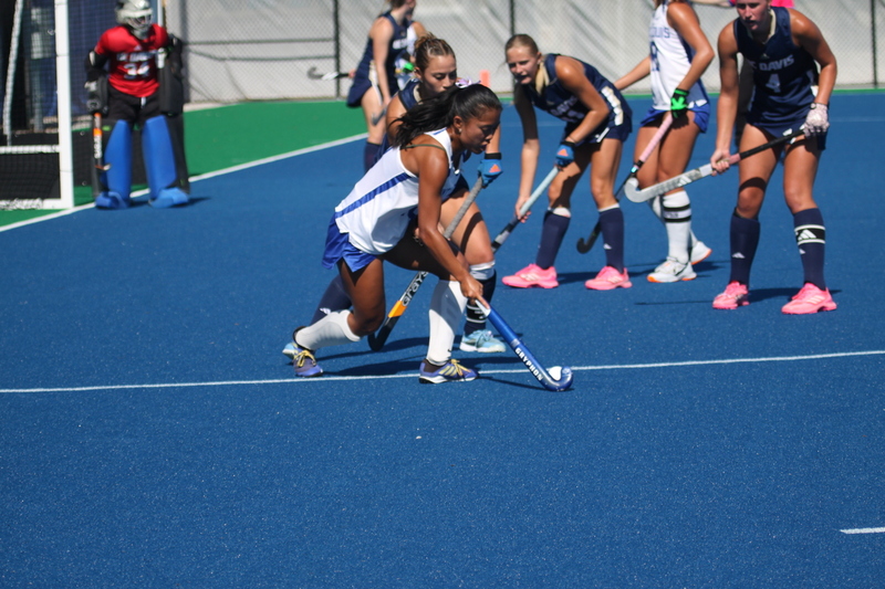 IMG_0409.jpg :: Saint Louis University (SLU) Women's Field Hockey vs University of California Davis 2025 at the SLU Field Hockey Complex. UC Davis won 2 to 1. The UC Davis players are wearing pink shoes and there are Pink Ribbons painted on the players sticks. Today is Billikens Pink Game for Breast Cancer Awareness and Alumnae Day. This is the second season at the new SLU Field Hockey Complex, and it marks, the 50th anniversary of the St. Louis University Field Hockey program which began in 1975. NCAA Division I 