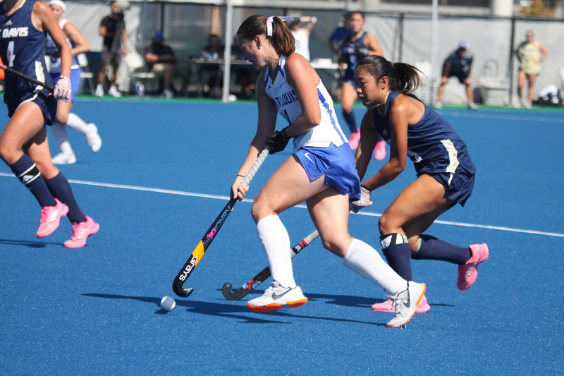IMG_0423.jpg :: Saint Louis University (SLU) Women's Field Hockey vs University of California Davis 2025 at the SLU Field Hockey Complex. UC Davis won 2 to 1. The UC Davis players are wearing pink shoes and there are Pink Ribbons painted on the players sticks. Today is Billikens Pink Game for Breast Cancer Awareness and Alumnae Day. This is the second season at the new SLU Field Hockey Complex, and it marks, the 50th anniversary of the St. Louis University Field Hockey program which began in 1975. NCAA Division I 