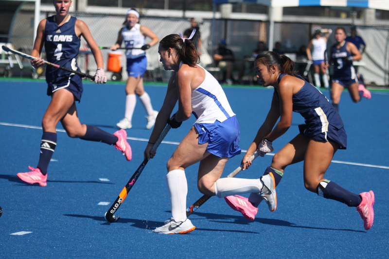 IMG_0424.jpg :: Saint Louis University (SLU) Women's Field Hockey vs University of California Davis 2025 at the SLU Field Hockey Complex. UC Davis won 2 to 1. The UC Davis players are wearing pink shoes and there are Pink Ribbons painted on the players sticks. Today is Billikens Pink Game for Breast Cancer Awareness and Alumnae Day. This is the second season at the new SLU Field Hockey Complex, and it marks, the 50th anniversary of the St. Louis University Field Hockey program which began in 1975. NCAA Division I 