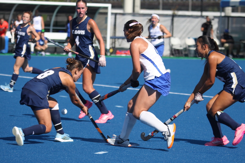 IMG_0425(2).jpg :: Saint Louis University (SLU) Women's Field Hockey vs University of California Davis 2025 at the SLU Field Hockey Complex. UC Davis won 2 to 1. The UC Davis players are wearing pink shoes and there are Pink Ribbons painted on the players sticks. Today is Billikens Pink Game for Breast Cancer Awareness and Alumnae Day. This is the second season at the new SLU Field Hockey Complex, and it marks, the 50th anniversary of the St. Louis University Field Hockey program which began in 1975. NCAA Division I 