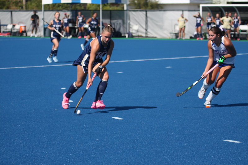 IMG_0426.jpg :: Saint Louis University (SLU) Women's Field Hockey vs University of California Davis 2025 at the SLU Field Hockey Complex. UC Davis won 2 to 1. The UC Davis players are wearing pink shoes and there are Pink Ribbons painted on the players sticks. Today is Billikens Pink Game for Breast Cancer Awareness and Alumnae Day. This is the second season at the new SLU Field Hockey Complex, and it marks, the 50th anniversary of the St. Louis University Field Hockey program which began in 1975. NCAA Division I 