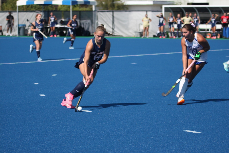 IMG_0427(1).jpg :: Saint Louis University (SLU) Women's Field Hockey vs University of California Davis 2025 at the SLU Field Hockey Complex. UC Davis won 2 to 1. The UC Davis players are wearing pink shoes and there are Pink Ribbons painted on the players sticks. Today is Billikens Pink Game for Breast Cancer Awareness and Alumnae Day. This is the second season at the new SLU Field Hockey Complex, and it marks, the 50th anniversary of the St. Louis University Field Hockey program which began in 1975. NCAA Division I 
