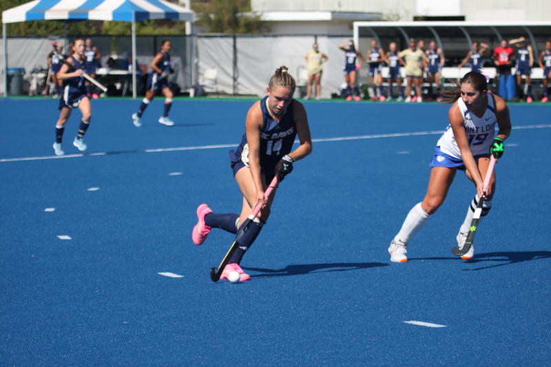 IMG_0428.jpg :: Saint Louis University (SLU) Women's Field Hockey vs University of California Davis 2025 at the SLU Field Hockey Complex. UC Davis won 2 to 1. The UC Davis players are wearing pink shoes and there are Pink Ribbons painted on the players sticks. Today is Billikens Pink Game for Breast Cancer Awareness and Alumnae Day. This is the second season at the new SLU Field Hockey Complex, and it marks, the 50th anniversary of the St. Louis University Field Hockey program which began in 1975. NCAA Division I 