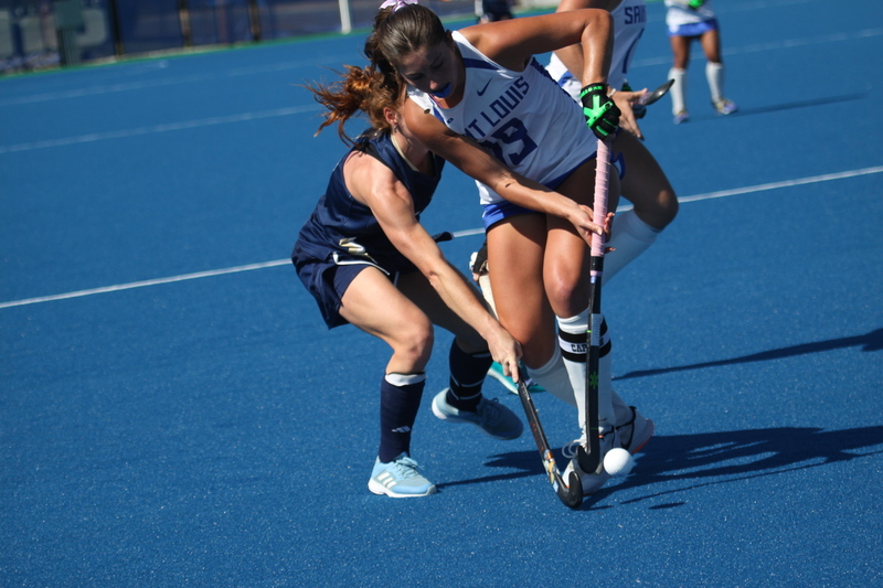 IMG_0447(2).jpg :: Saint Louis University (SLU) Women's Field Hockey vs University of California Davis 2025 at the SLU Field Hockey Complex. UC Davis won 2 to 1. The UC Davis players are wearing pink shoes and there are Pink Ribbons painted on the players sticks. Today is Billikens Pink Game for Breast Cancer Awareness and Alumnae Day. This is the second season at the new SLU Field Hockey Complex, and it marks, the 50th anniversary of the St. Louis University Field Hockey program which began in 1975. NCAA Division I 