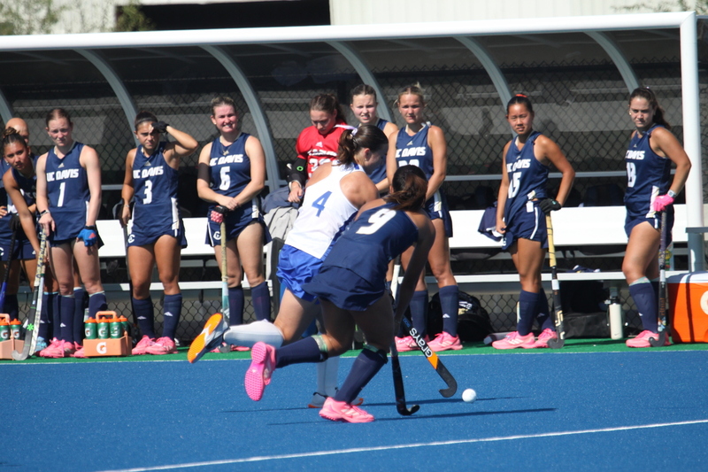 IMG_0462.jpg :: Saint Louis University (SLU) Women's Field Hockey vs University of California Davis 2025 at the SLU Field Hockey Complex. UC Davis won 2 to 1. The UC Davis players are wearing pink shoes and there are Pink Ribbons painted on the players sticks. Today is Billikens Pink Game for Breast Cancer Awareness and Alumnae Day. This is the second season at the new SLU Field Hockey Complex, and it marks, the 50th anniversary of the St. Louis University Field Hockey program which began in 1975. NCAA Division I 