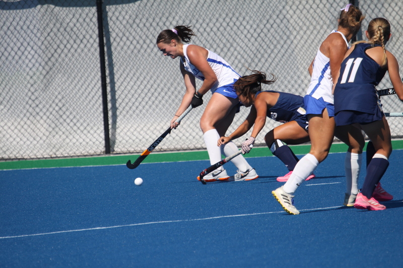 IMG_0464(1).jpg :: Saint Louis University (SLU) Women's Field Hockey vs University of California Davis 2025 at the SLU Field Hockey Complex. UC Davis won 2 to 1. The UC Davis players are wearing pink shoes and there are Pink Ribbons painted on the players sticks. Today is Billikens Pink Game for Breast Cancer Awareness and Alumnae Day. This is the second season at the new SLU Field Hockey Complex, and it marks, the 50th anniversary of the St. Louis University Field Hockey program which began in 1975. NCAA Division I 