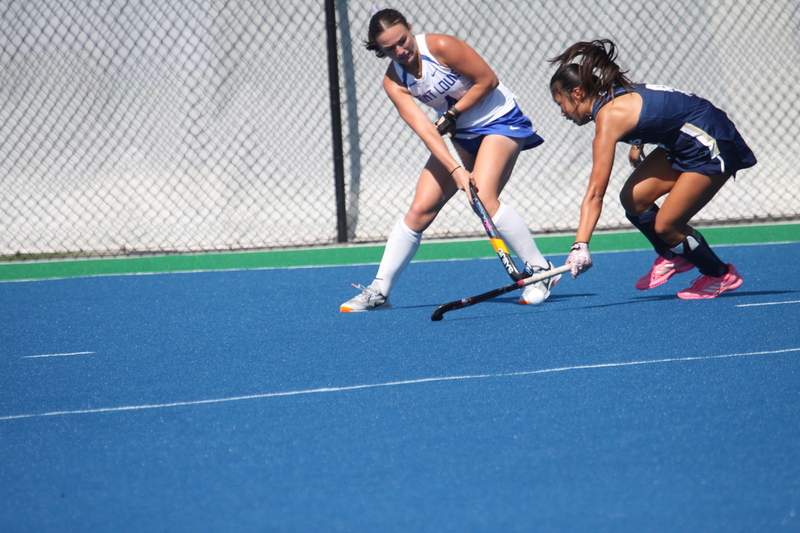 IMG_0466(1).jpg :: Saint Louis University (SLU) Women's Field Hockey vs University of California Davis 2025 at the SLU Field Hockey Complex. UC Davis won 2 to 1. The UC Davis players are wearing pink shoes and there are Pink Ribbons painted on the players sticks. Today is Billikens Pink Game for Breast Cancer Awareness and Alumnae Day. This is the second season at the new SLU Field Hockey Complex, and it marks, the 50th anniversary of the St. Louis University Field Hockey program which began in 1975. NCAA Division I 