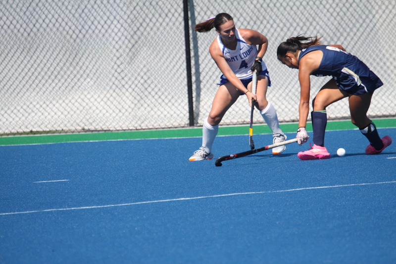 IMG_0467(1).jpg :: Saint Louis University (SLU) Women's Field Hockey vs University of California Davis 2025 at the SLU Field Hockey Complex. UC Davis won 2 to 1. The UC Davis players are wearing pink shoes and there are Pink Ribbons painted on the players sticks. Today is Billikens Pink Game for Breast Cancer Awareness and Alumnae Day. This is the second season at the new SLU Field Hockey Complex, and it marks, the 50th anniversary of the St. Louis University Field Hockey program which began in 1975. NCAA Division I 