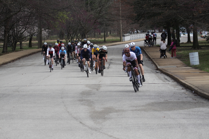 Mike Murray Classic Criterium 2025 D -LXXIV.jpg :: Tour of St. Louis in St. Louis, Missouri, USA., today's race is the Mike Murray Classic Criterium 2025, USAC CAT 4 BAR, 60 Min. race. Mike Murray Classic Course - A flat and fast course with wide open straightaways and a few technical turns. Race by St. Louis landmarks, the Missouri History Museum and The Muny Opera. Peloton - In a bicycle race, the term - Peloton - refers to the main group of riders, also known as the -pack- or -bunch-. Riders race in a pack to draft, which means they ride closely together to save energy and improve speed. 