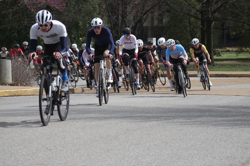 Mike Murray Classic Criterium 2025 D -LXXXII.jpg :: Tour of St. Louis in St. Louis, Missouri, USA., today's race is the Mike Murray Classic Criterium 2025, USAC CAT 4 BAR, 60 Min. race. Mike Murray Classic Course - A flat and fast course with wide open straightaways and a few technical turns. Race by St. Louis landmarks, the Missouri History Museum and The Muny Opera. Peloton - In a bicycle race, the term - Peloton - refers to the main group of riders, also known as the -pack- or -bunch-. Riders race in a pack to draft, which means they ride closely together to save energy and improve speed. 