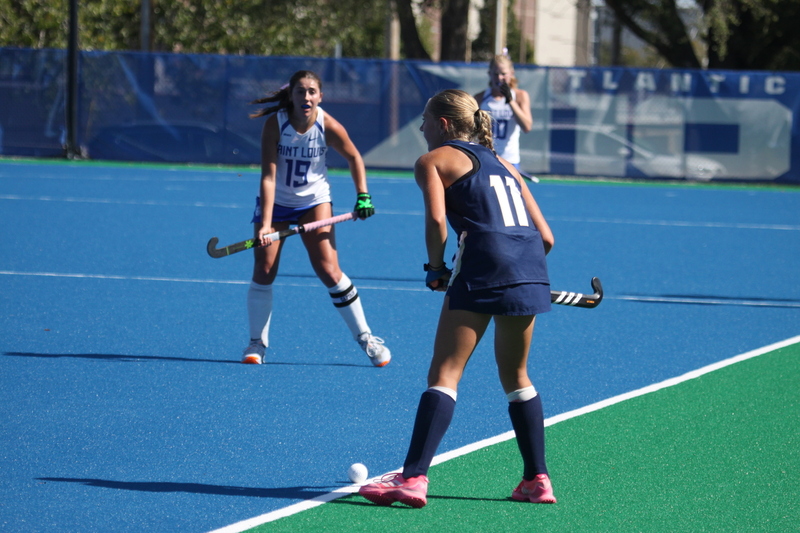 Saint Louis University (SLU) Womens Field Hockey vs UC Davis 2025 LXXXVI.jpg :: Saint Louis University (SLU) Women's Field Hockey vs University of California Davis 2025 at the SLU Field Hockey Complex. UC Davis won 2 to 1. The UC Davis players are wearing pink shoes and there are Pink Ribbons painted on the players sticks. Today is Billikens Pink Game for Breast Cancer Awareness and Alumnae Day. This is the second season at the new SLU Field Hockey Complex, and it marks, the 50th anniversary of the St. Louis University Field Hockey program which began in 1975. NCAA Division I 