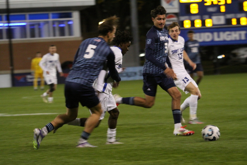 Saint Louis University Mens Soccer vs University of Rhode Island 2025 IX.jpg :: Saint Louis University (SLU) Men's Soccer vs University of Rhode Island (URI) at Robert R. Hermann Stadium in St. Louis, Missouri, USA on a wet and cold night. The rain began in early afternoon and continued off and on all night. This was a Division I match up of NCAA Men's Soccer November 1st 2025. 