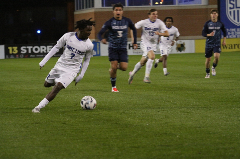 Saint Louis University Mens Soccer vs University of Rhode Island 2025 VI.jpg :: Saint Louis University (SLU) Men's Soccer vs University of Rhode Island (URI) at Robert R. Hermann Stadium in St. Louis, Missouri, USA on a wet and cold night. The rain began in early afternoon and continued off and on all night. This was a Division I match up of NCAA Men's Soccer November 1st 2025. 