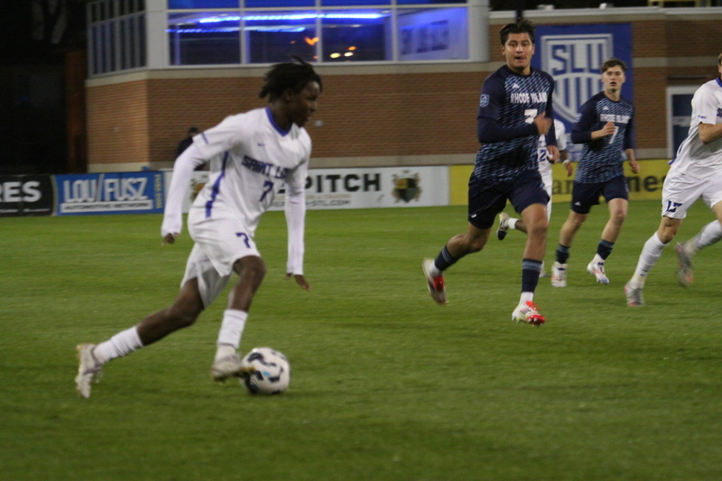Saint Louis University Mens Soccer vs University of Rhode Island 2025 VII.jpg :: Saint Louis University (SLU) Men's Soccer vs University of Rhode Island (URI) at Robert R. Hermann Stadium in St. Louis, Missouri, USA on a wet and cold night. The rain began in early afternoon and continued off and on all night. This was a Division I match up of NCAA Men's Soccer November 1st 2025. 