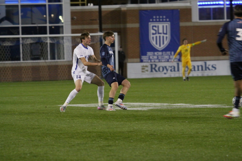 Saint Louis University Mens Soccer vs University of Rhode Island 2025 XIV.jpg :: Saint Louis University (SLU) Men's Soccer vs University of Rhode Island (URI) at Robert R. Hermann Stadium in St. Louis, Missouri, USA on a wet and cold night. The rain began in early afternoon and continued off and on all night. This was a Division I match up of NCAA Men's Soccer November 1st 2025. 
